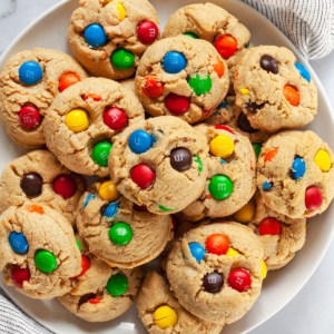 Peanut butter cookies with m&ms on a plate.