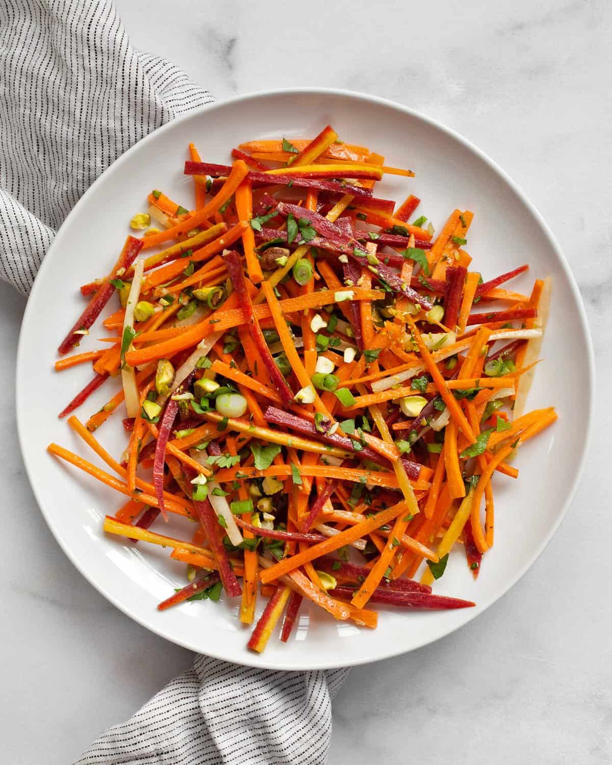 Carrot salad on a small plate.