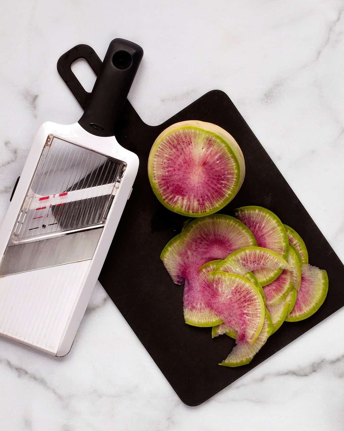 How to cut a watermelon radish with a mandolin.