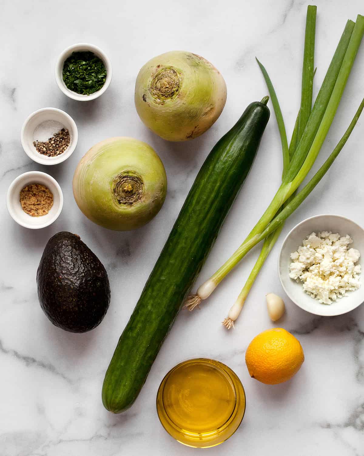 Ingredients including radishes, cucumbers, scallions, feta and lemon