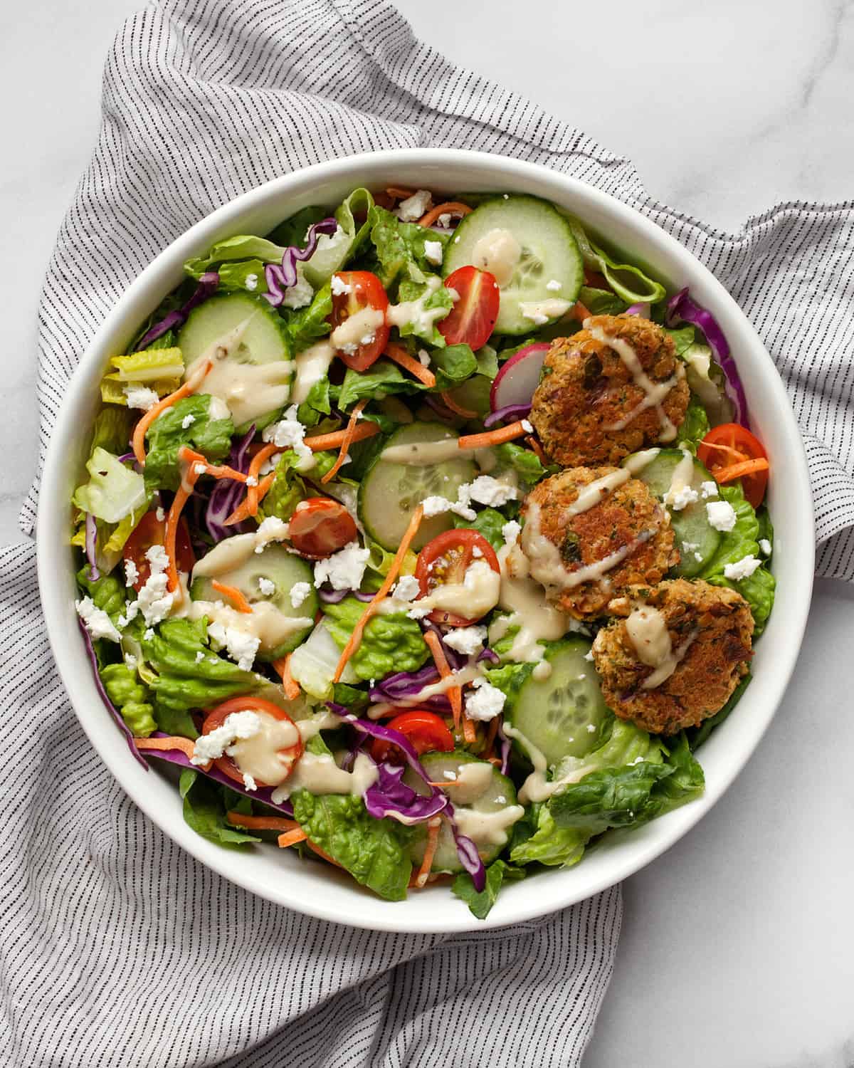 Salad with baked falafel in a bowl.