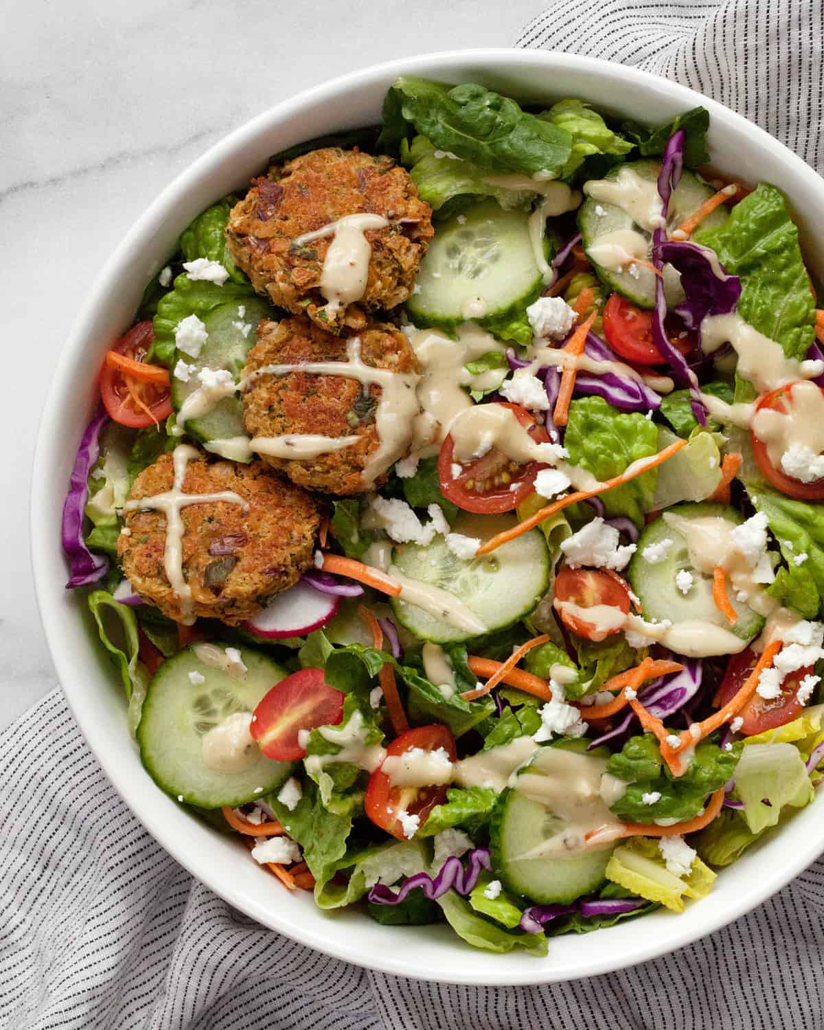 Salad with baked falafel in a bowl.