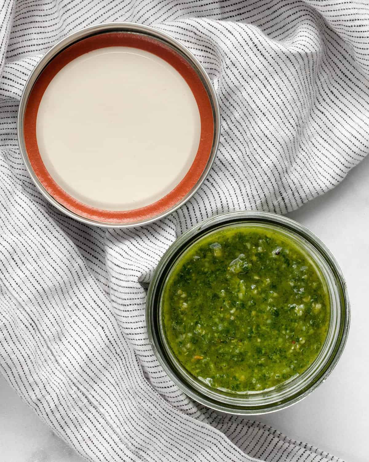 Basil pesto in a jar with a lid.