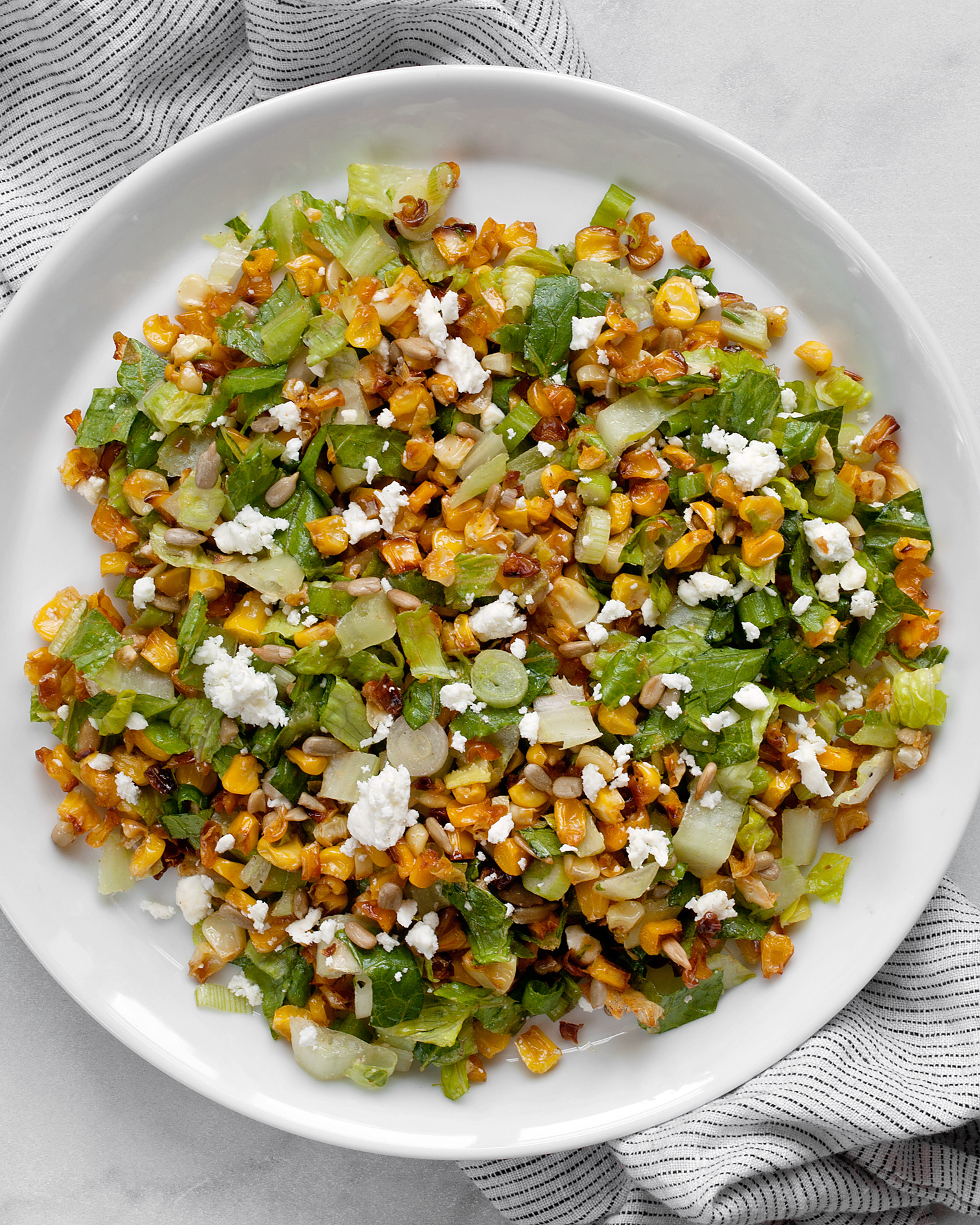 Roasted corn salad on a plate.