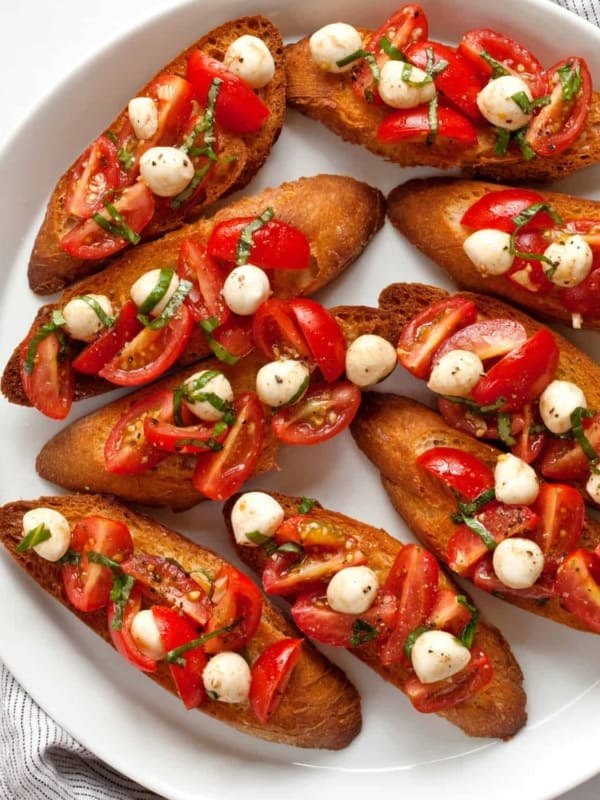 Caprese bruschetta on a plate.