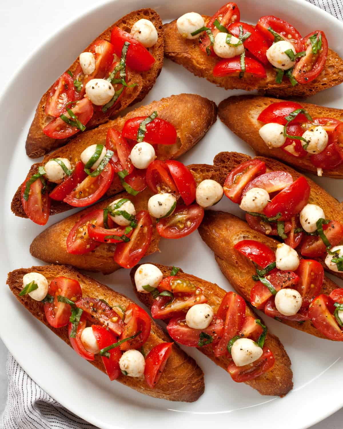 Caprese bruschetta on a plate.