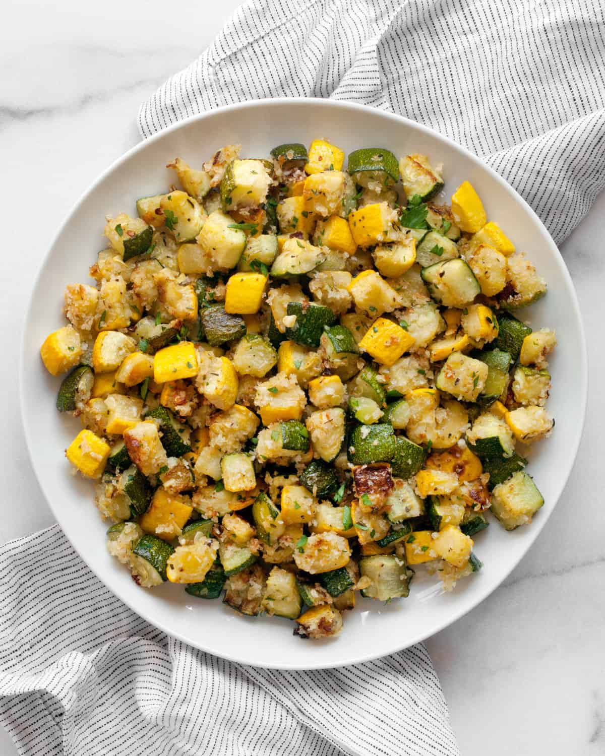 Roasted zucchini and squash on a plate.