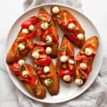 Caprese bruschetta on a plate.