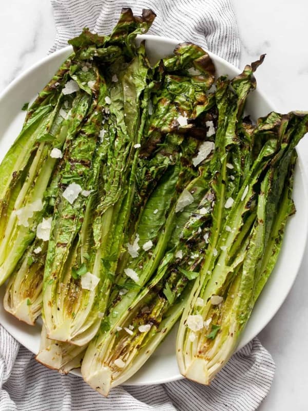 Grilled romaine salad on a plate.