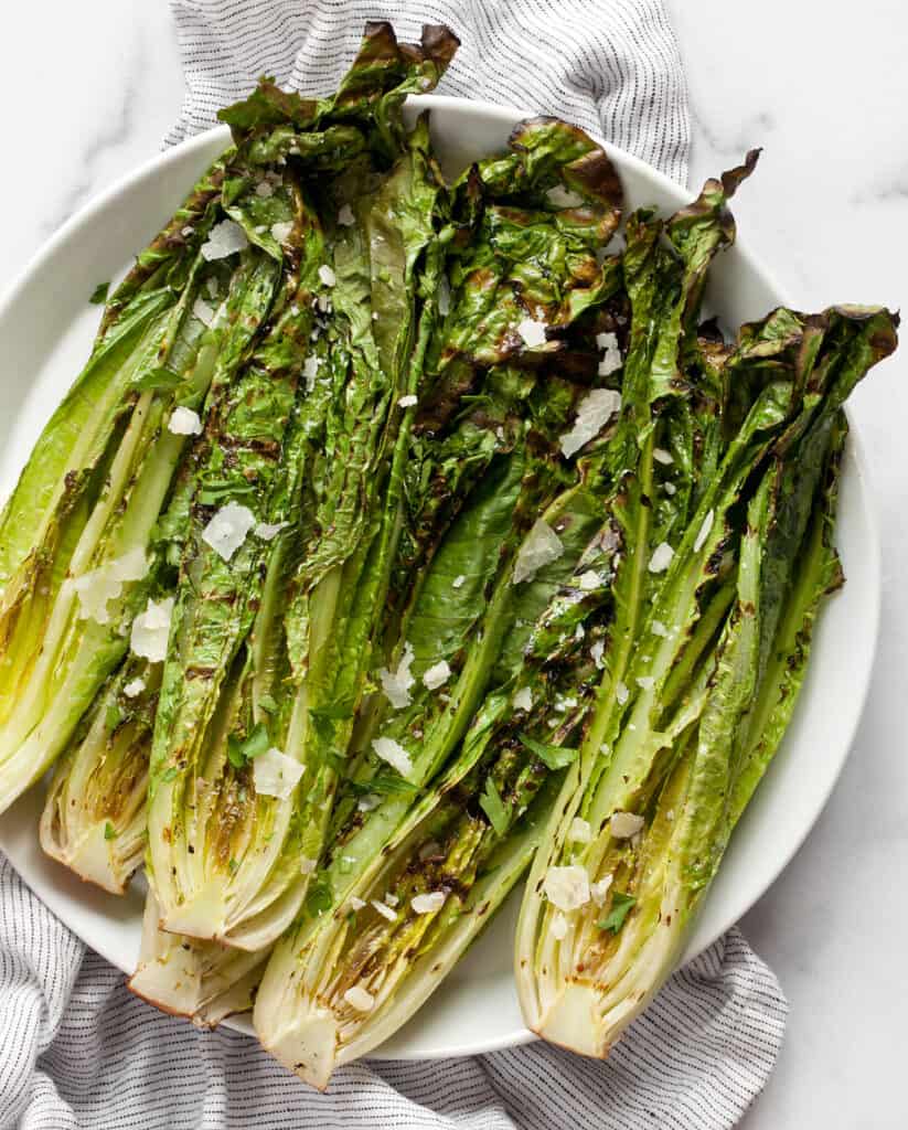 Grilled romaine salad on a plate.