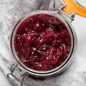 Homemade cranberry sauce in a jar.