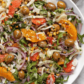 Fennel salad with oranges and olives on a plate.