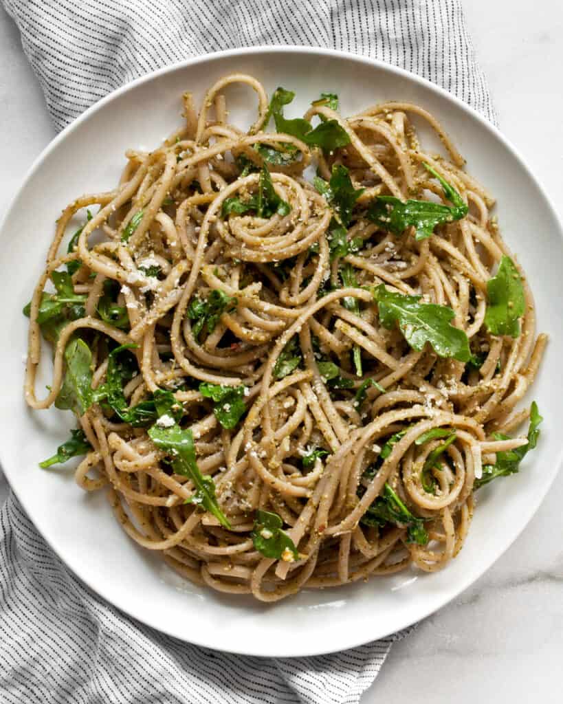 Arugula pasta on a plate.