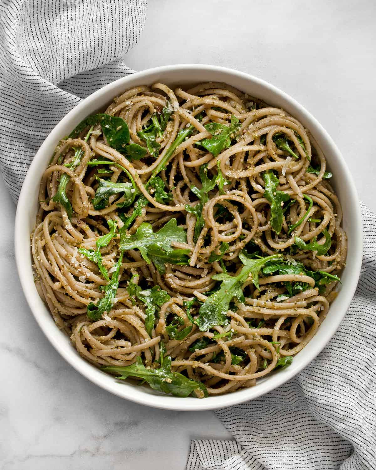 Arugula pasta in a large bowl.