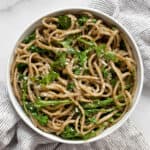 Arugula pesto pasta in a small bowl.