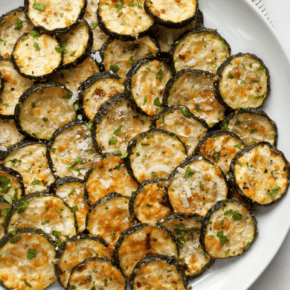 Sliced roasted zucchini on a plate.