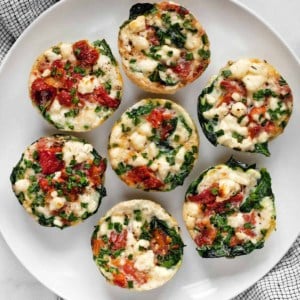 Spinach feta egg white bites on a plate.