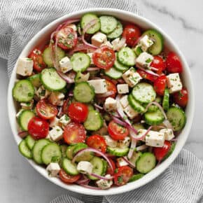 Cucumber tomato feta salad in a bowl.