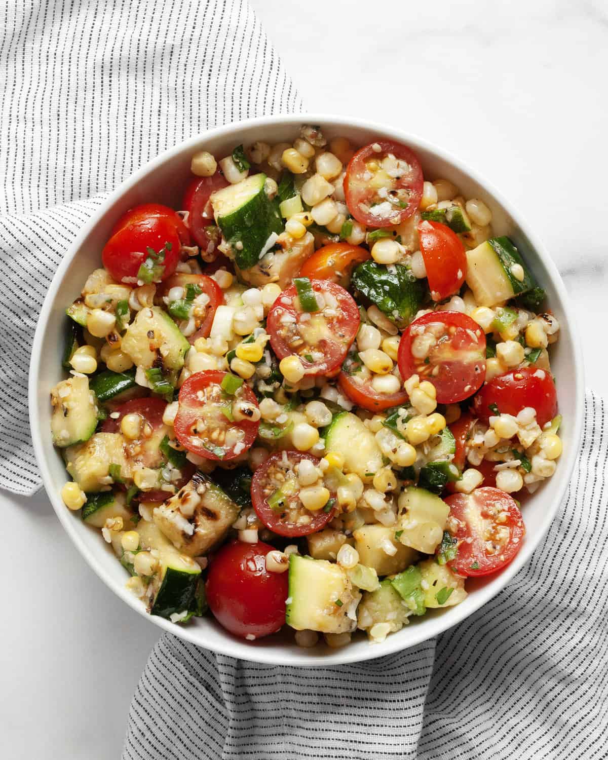 Zucchini and corn salad in a small bowl.