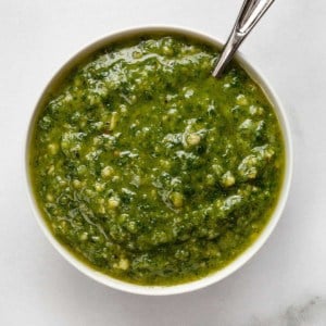 Homemade basil pesto in a bowl.