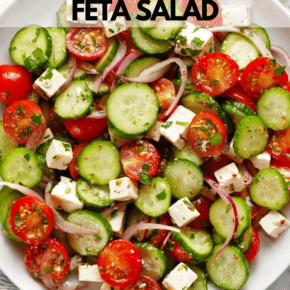 Tomato cucumber feta salad on a plate.