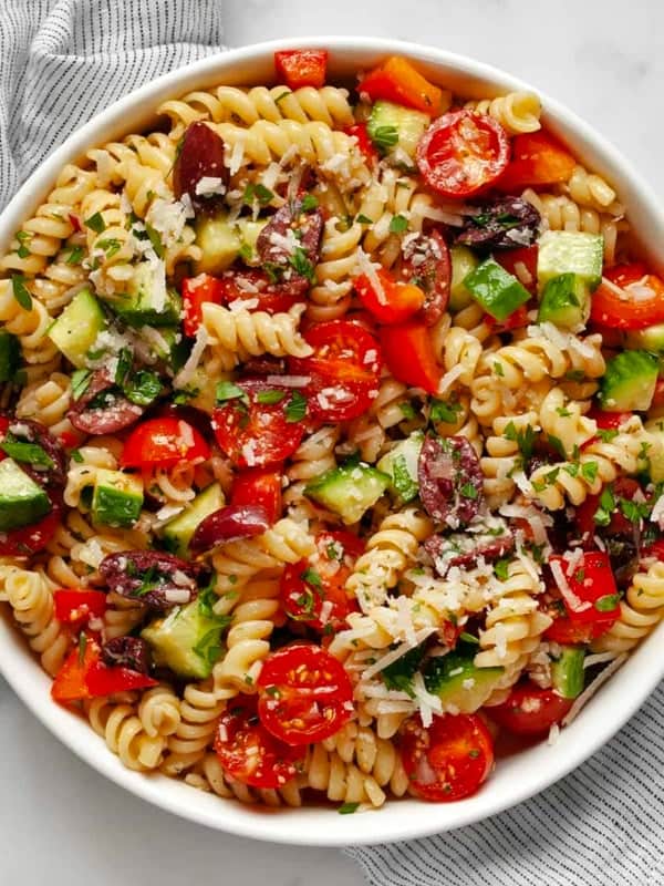 Pasta salad with Italian dressing in a bowl.