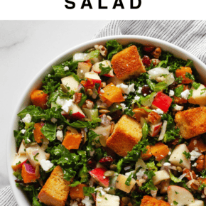 Fall harvest salad with butternut squash and apples in a bowl.