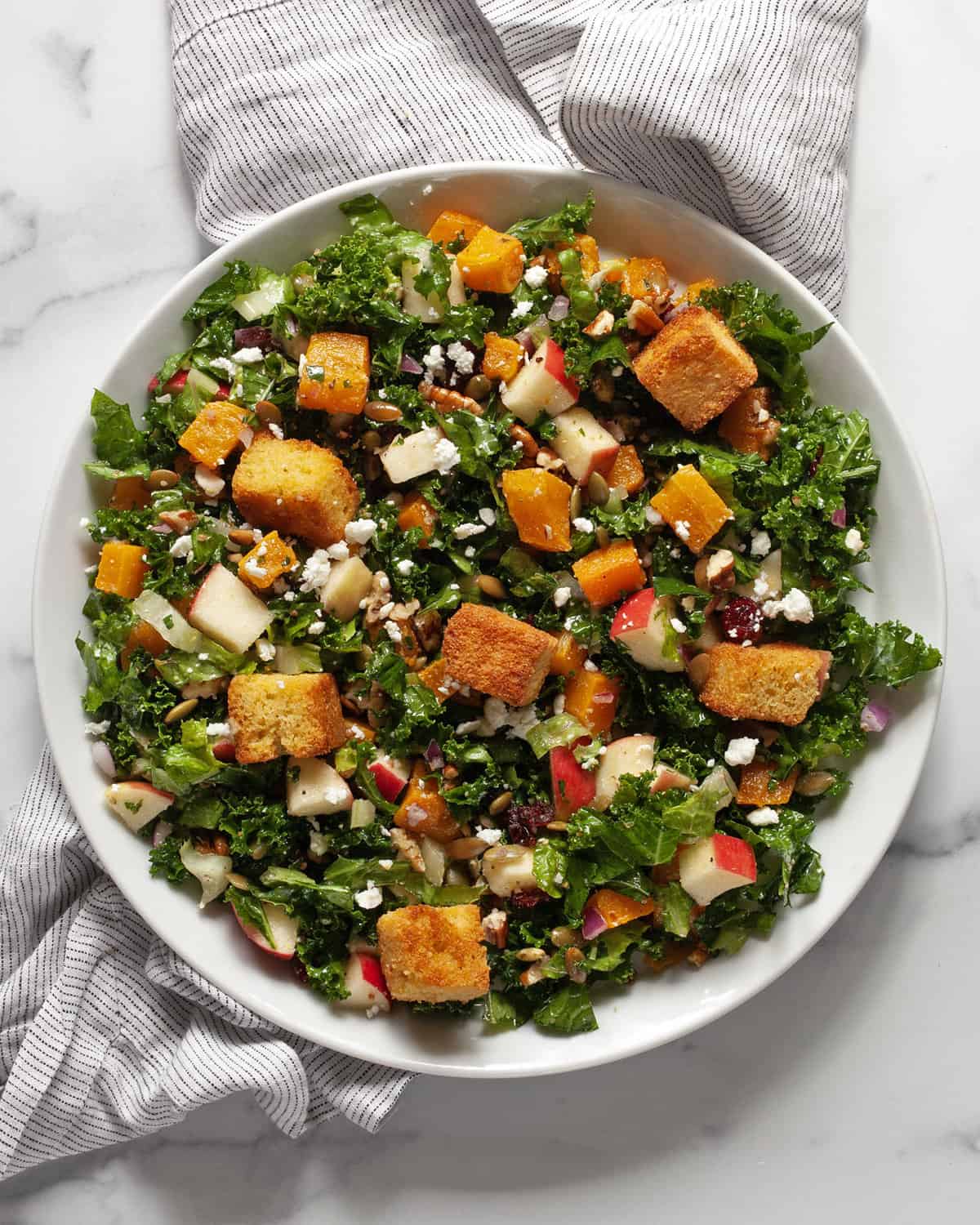 Fall harvest salad on a serving plate.