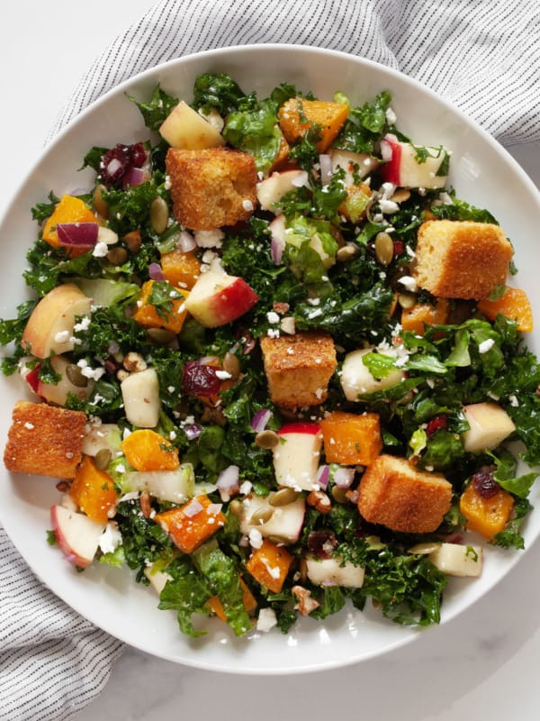 Fall harvest salad with roasted butternut and apples on a plate.