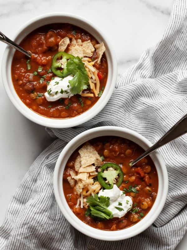 Two bowls of pumpkin chili.