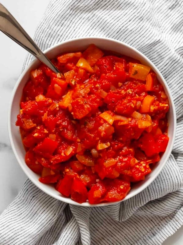Stewed tomatoes in a small bowl.