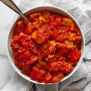 Stewed tomatoes in a small bowl.