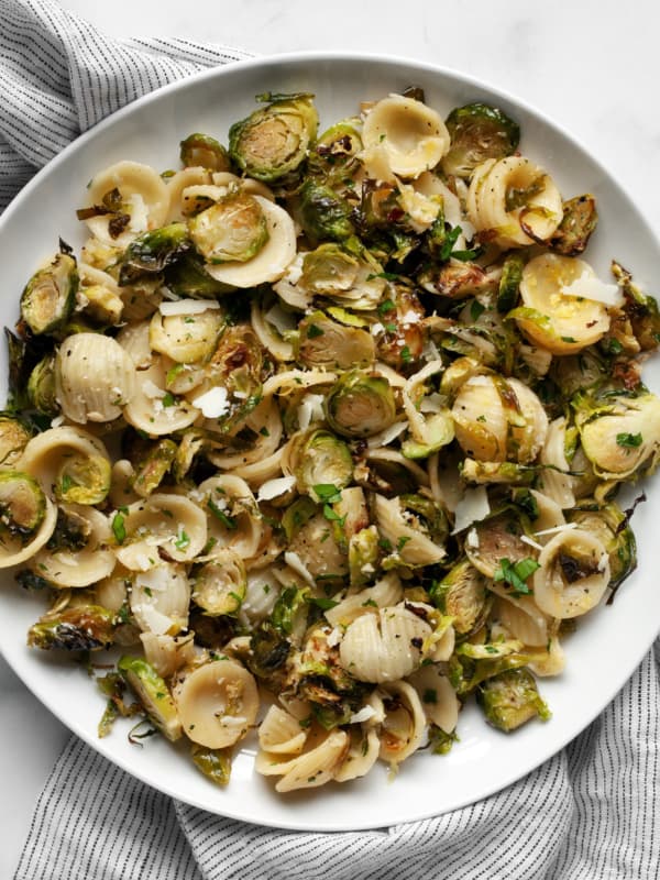 Orecchiette with roasted brussels sprouts on a plate.