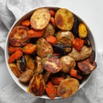 Roasted potatoes and carrots in a bowl.