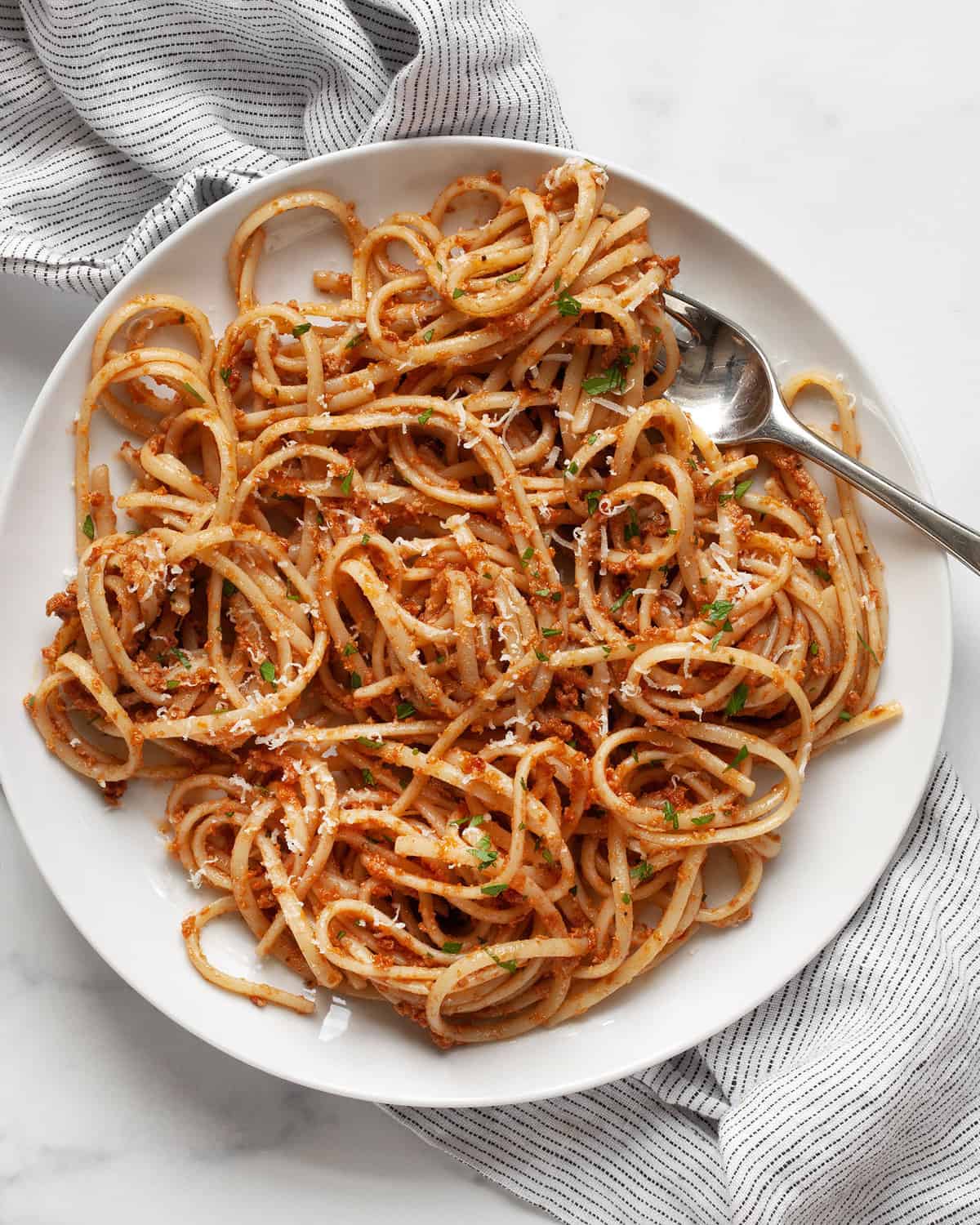 Sun-dried tomato pesto pasta on a plate.