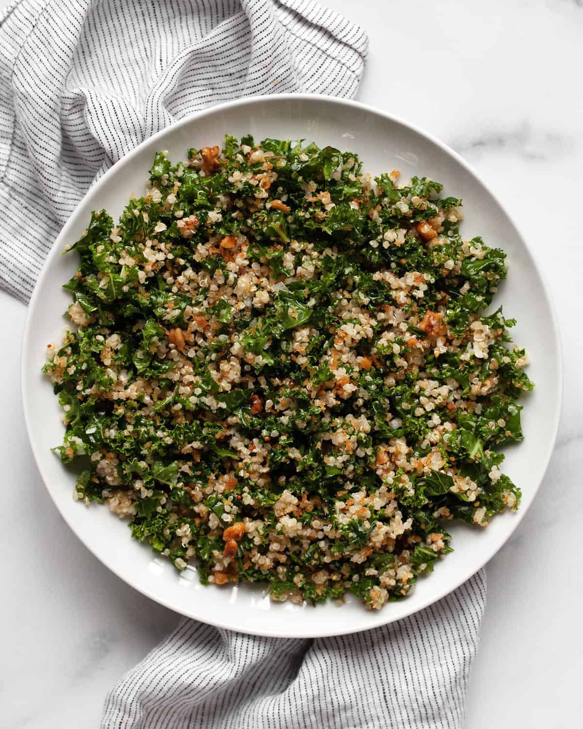 Kale quinoa salad on a plate.