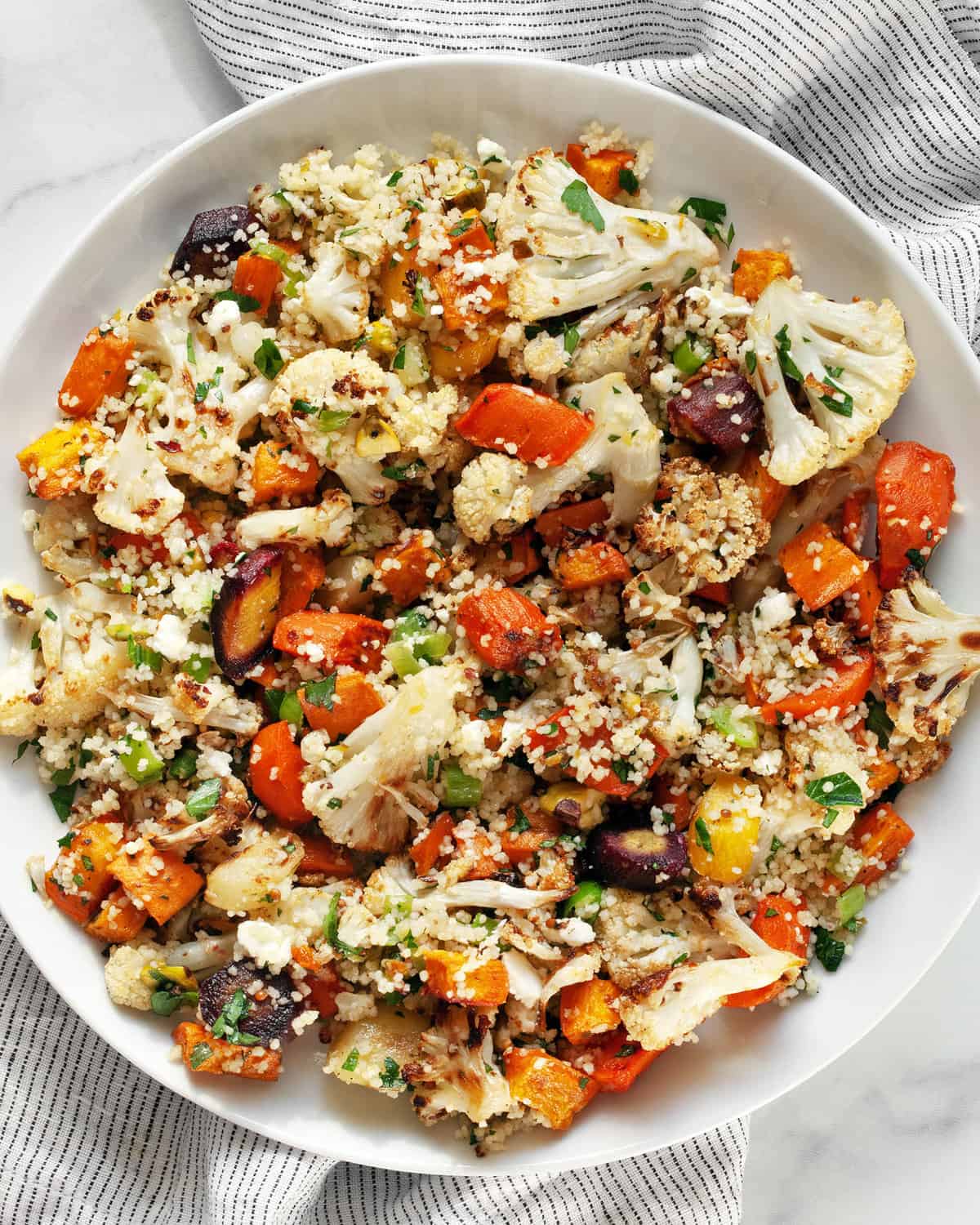 Roasted vegetable couscous salad on a plate.