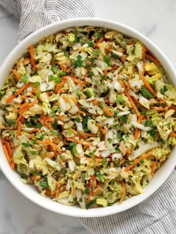 Napa cabbage salad with peanut dressing in a bowl.