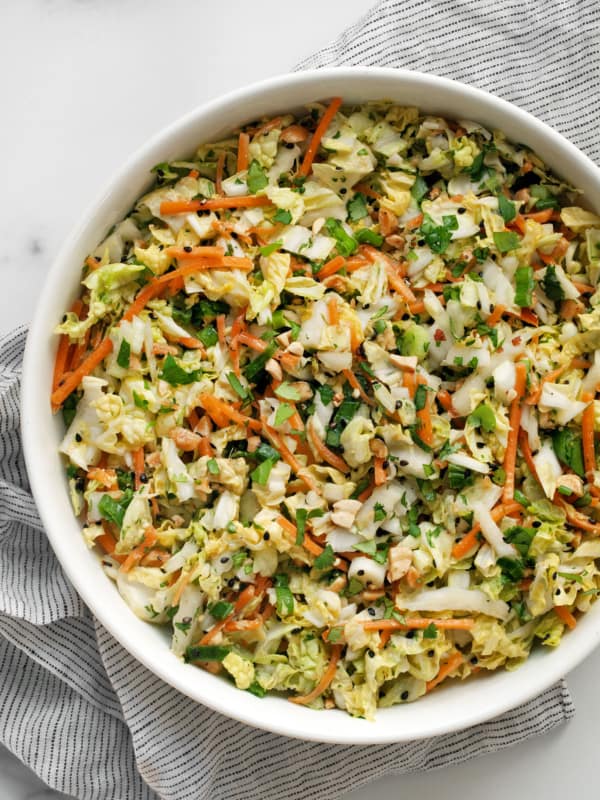 Napa cabbage salad with peanut dressing in a bowl.