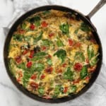 Roasted vegetable frittata in a skillet.