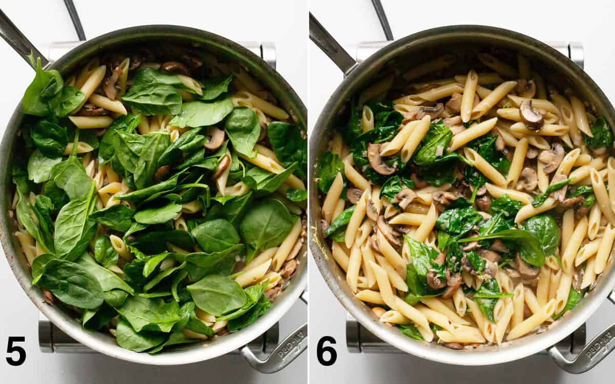 Baby spinach stirred into penne. Spinach wilted in spinach in the pan.