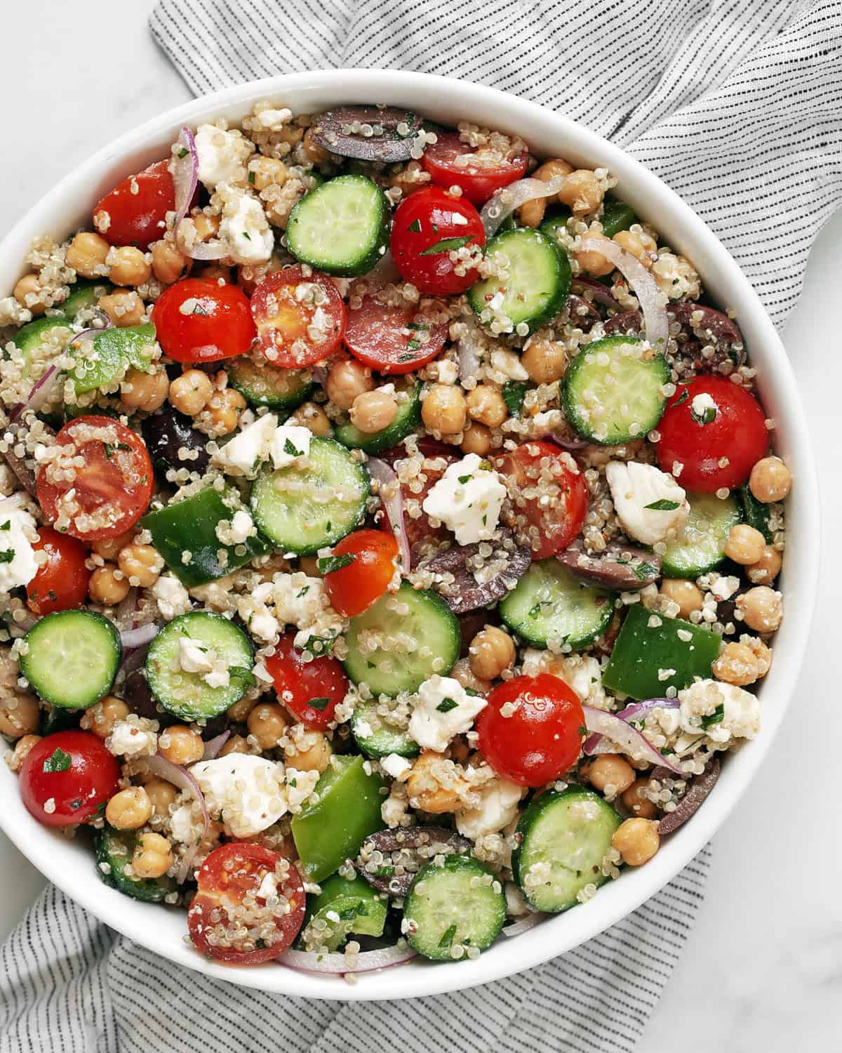 Greek quinoa salad in a bowl.