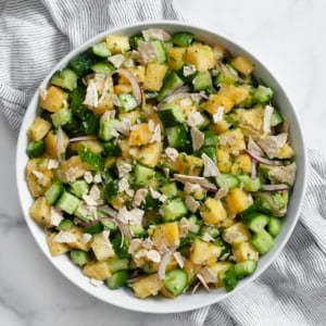 Pineapple cucumber salad in a bowl.