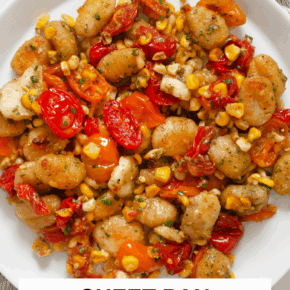 Sheet pan gnocchi with tomatoes and corn on a plate.