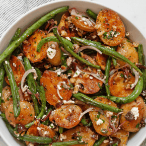 Roasted potato green bean salad in a bowl.