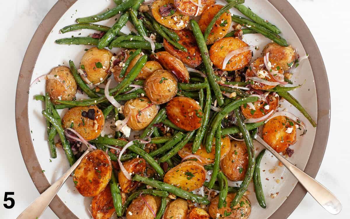 Salad ingredients tossed in a large bowl.