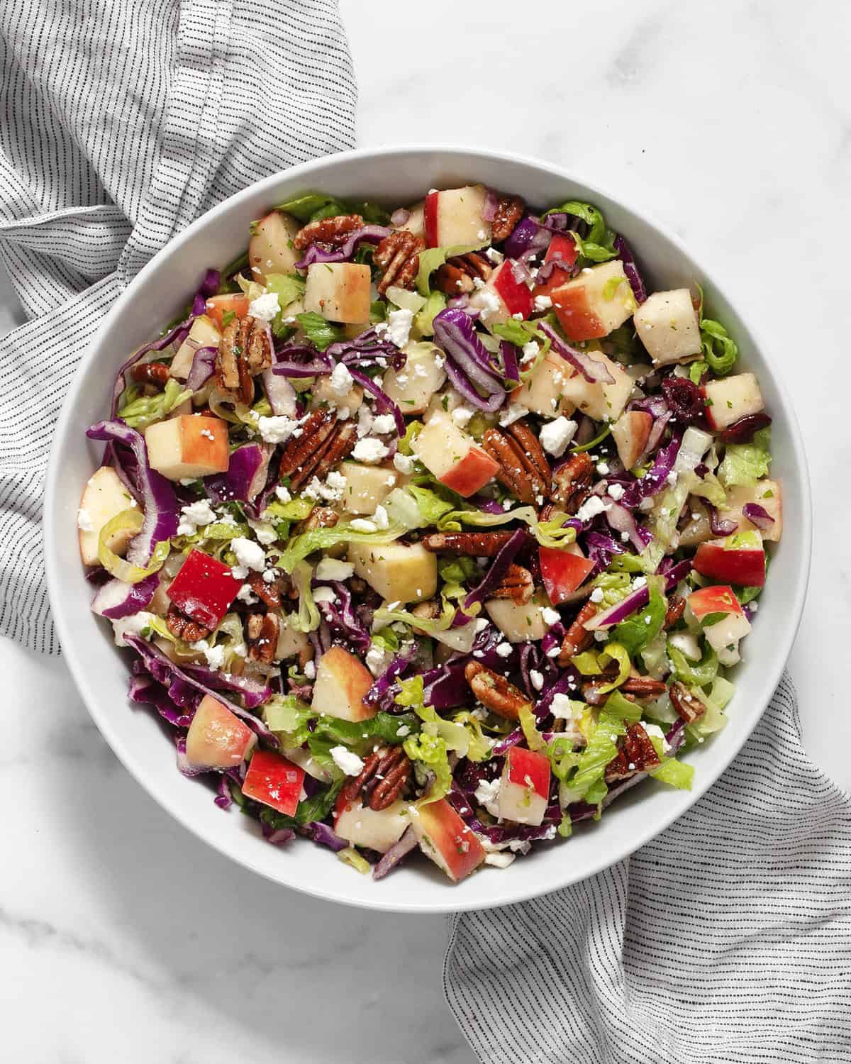 Apple pecan salad in a bowl.