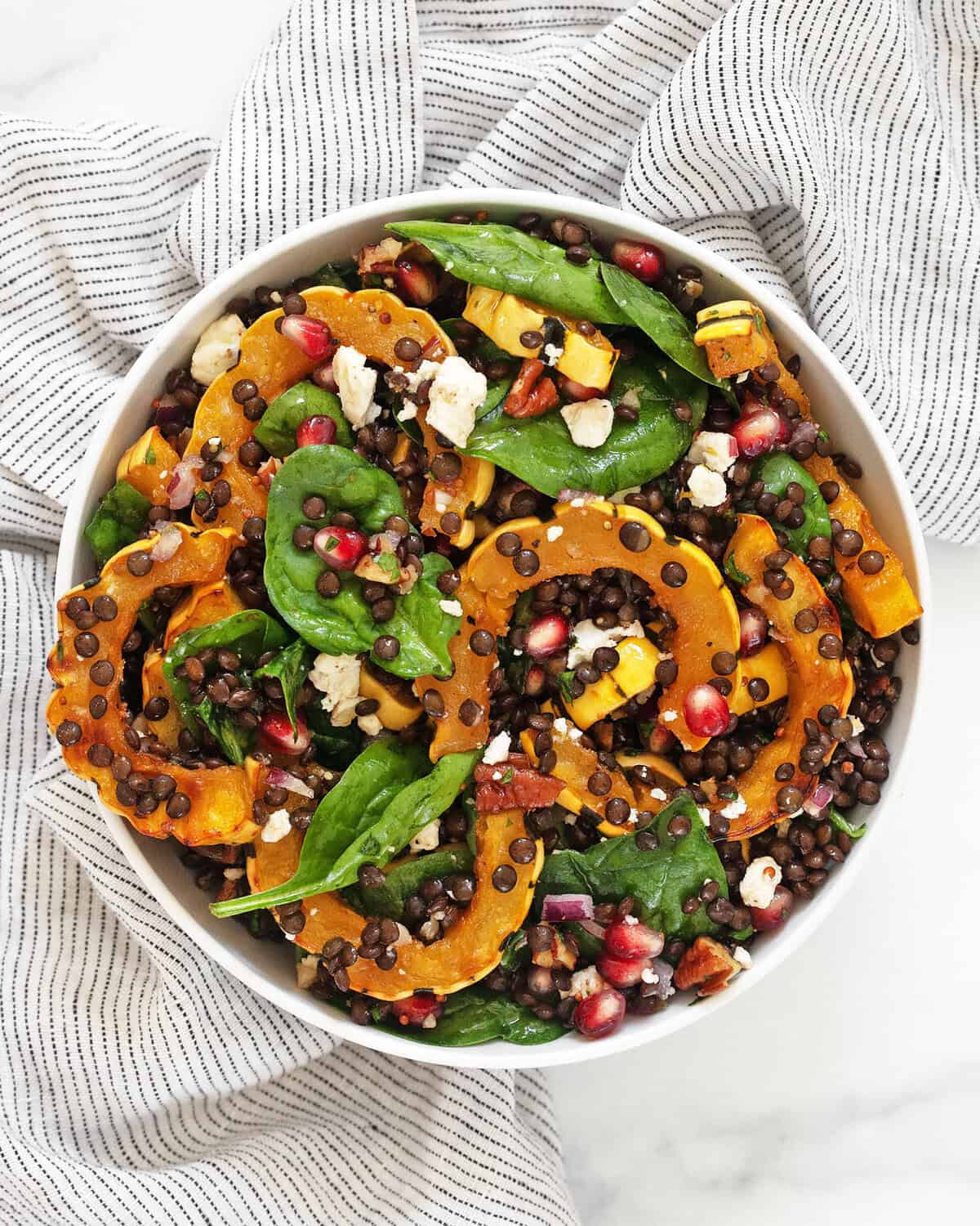 Roasted delicata squash salad in a bowl.