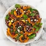Roasted delicata squash salad on a plate.