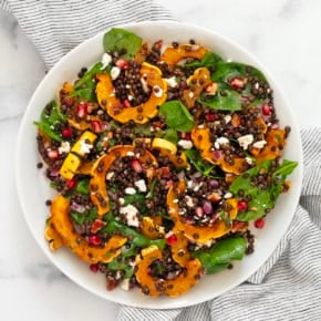 Roasted delicata squash salad on a plate.